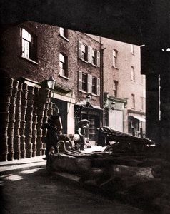 Frugtkurve stablet mod huse på Borough Market, London, 1926-1927