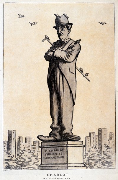 Charlot i statue med skrift på soklen: "A Charlot, den taknemmelige menneskehed"" ("Charlot ne s