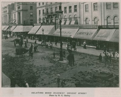 Relaying wood roadway Regent Street af English Photographer