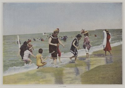 Børn leger med et reb på stranden (farvefoto) af French Photographer