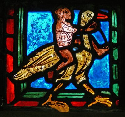 Hjørnestykke fra et vindue, der forestiller lignelsen om den barmhjertige samaritaner: mand og fugl af French School