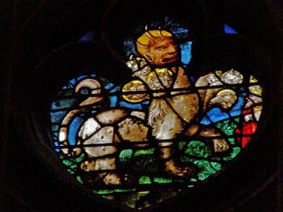 Vinduet med vestrosen viser en scene fra Åbenbaringens Bog: Beast af French School