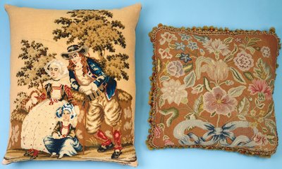 Two cushions with needlework panels worked in colored silks and wools dani af French School