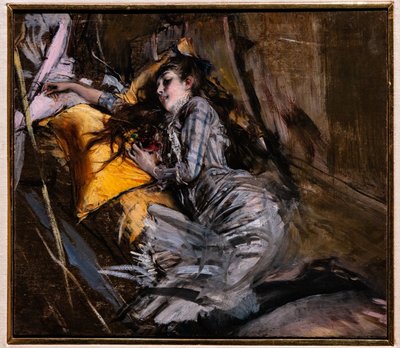 Liggende pige i tartan kjole af Giovanni Boldini