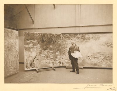 Claude Monet (1840-1926) foran sine malerier 