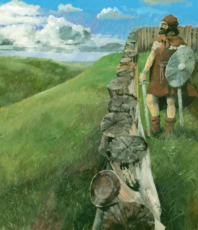 Rekonstruktionstegning af en jernaldermand, der står ved siden af et palisadehegn af træ på toppen af Liddington Castle Hillfort, Swindon, Storbritannien. af Ivan Lapper