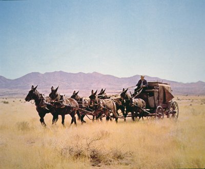 Western Stagecoach trukket af et hold med seks muldyr (foto) af Walter Charles Mills
