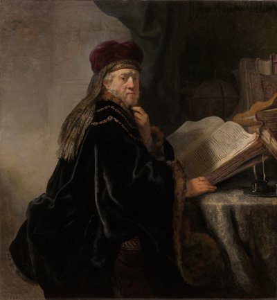 En lærd, der sidder ved en skrivebordslærd ved sit studie af Rembrandt van Rijn