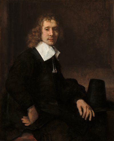 En ung mand ved et bord (muligvis Govaert Flinck) af Rembrandt van Rijn