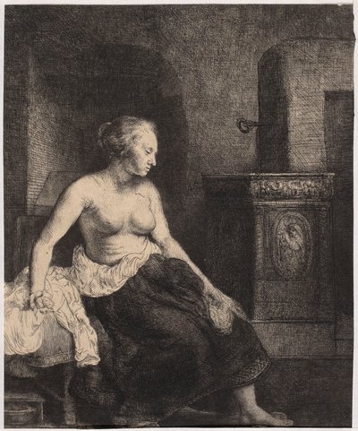 En halvnøgen kvinde, der sidder ved ovnen af Rembrandt van Rijn