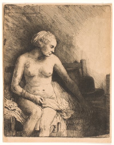 Kvinde ved badet med en hat ved siden af sig af Rembrandt van Rijn