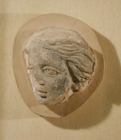 Relief forestillende hovedet af en kvinde, fra Tunesien (stuk) af Roman