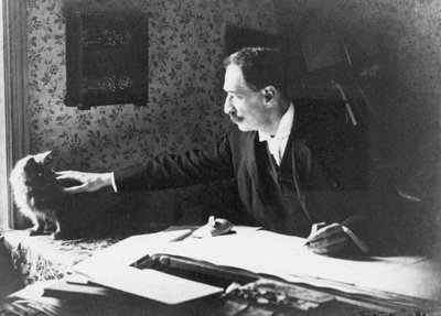 Louis Wain ved hans tegnebræt, 1890