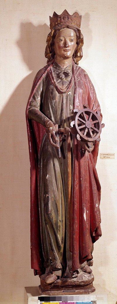 Repræsentation af den hellige Katarina af Alexandria, der holder hjulet instrument af hendes pine. Polykrom træstatue af Unknown artist