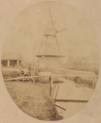 [Maler med hat ved staffeliet maler en vindmølle]. af Unknown artist