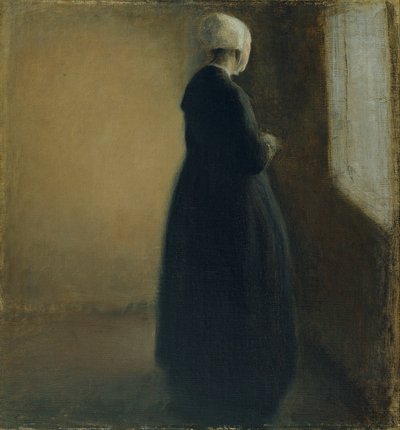 En gammel kvinde, der står ved et vindue af Vilhelm Hammershøi