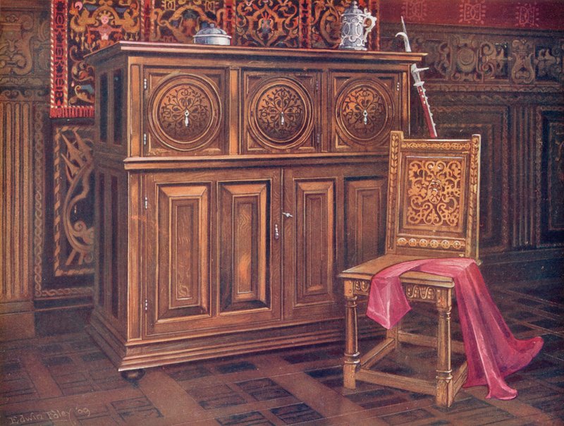 Egetræsskab, med cirkulære konvekse paneler, indskåret arabesk ornament. Valnøddestol, med sammenflettet ornament af Edwin John Foley