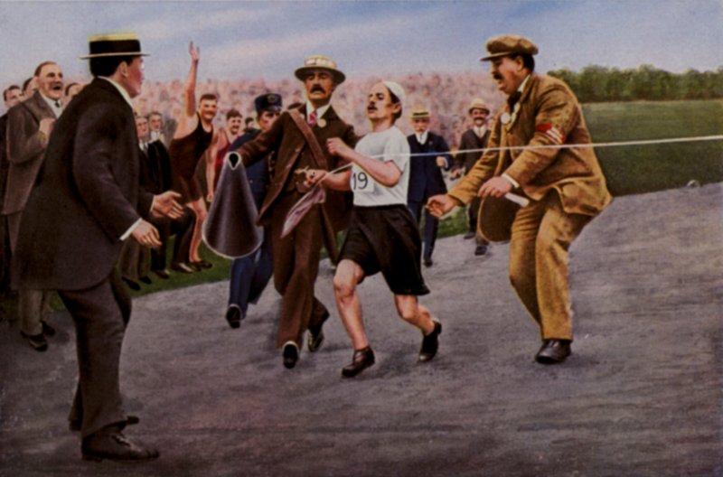 Suffering from dehydration and exhaustion. Italian athlete Dorando Pietri is helped across the finishing line to win the marathon at the Olympic Games, London, 1908dani af English Photographer