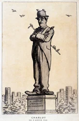 Charlot i statue med skrift på soklen: "A Charlot, den taknemmelige menneskehed"" ("Charlot ne s