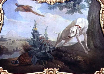 Hund med vildt i et landskab