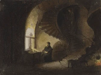 Mand siddende ved et vindue