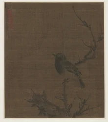 Sovende fugl på en Prunus-gren