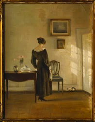 Et interiør med en kvinde, der fodrer en kat (olie på lærred)