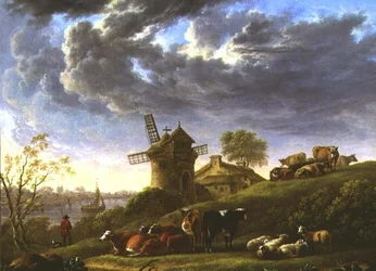 Solbeskinnede græsgange ved en landsby ved floden