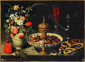 Bord med kande, blomster, tørret frugt ...