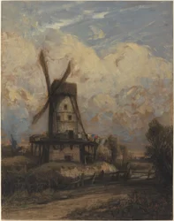 En vindmølle mod en overskyet himmel