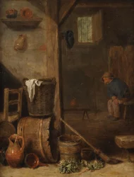 Et køkkeninteriør med en figur, der sidder i det tilstødende rum