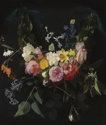 Blomsterkrans ophængt i to blå bånd