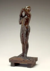 Danser, der justerer skulderremmen på hendes bodice, 1880