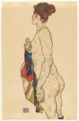 Stående nøgen med mønstret kappe. 1917
