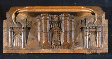 En misericord, der skildrer Sir Yvains hest fanget, da portcullisen til en omfattende slotindgang sænkes, New College Chapel, Oxford, slutningen af det 14. århundrede (træ)