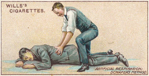 Kunstigt åndedræt, Schafers Method, nr. 25 fra First Aid-serien af Willss Cigarette-kort, 1913