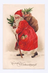 Edwardiansk postkort af julemanden, der bærer et juletræ og en sæk med legetøj over skulderen, ca. 1910 (farvelitografi)