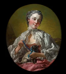 En ung dame, der holder en mopshund