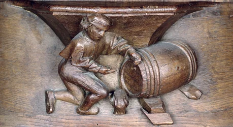 Udskæring, der forestiller en mand, der sætter en hane på en tønde, fra en korbod fra klosteret St. Lucien i Beauvais (træ)