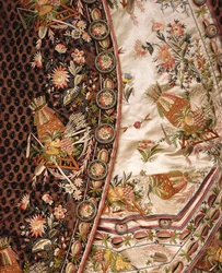 Detail of a magnificent suit of brown cut velvet, comprising coat, breeches & waist of ivory satin embroidered en suite, c.1760dani
