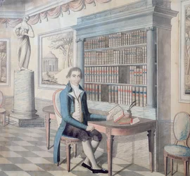 Herre læser i sit bibliotek
