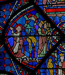 St Thomas-vinduet: mens han beder, bryder dæmonen hedenske statuer (w23)