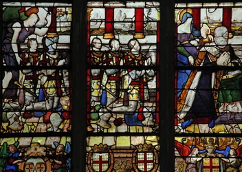 Vindue w13 viser Anne de Montmorency med sin skytshelgen St. Anne (der lærer Jomfruen at læse) og 5 af hans sønner