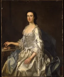 Mary, hustru til Henry, 7. Lord Arundell af Wardour, i en grå satinkjole, med roser ved et bord