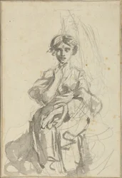 Siddende kvindefigur