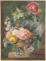 Blomsterbuket i en vase med en fuglerede