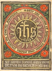 Monogram JHS i en flammende cirkel
