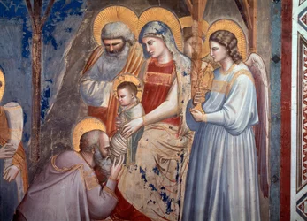 Tilbedelsen af Magi. Detalje, der viser magikeren, der lægger sig ned foran Jesus i Marias arme mellem englen og Saint Joseph (fresco