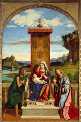 Jomfruen har et barn mellem Sankt Johannes Døberen og Sankt Maria Magdalena. Maleri af Cima Da Conegliano (1459-1517)