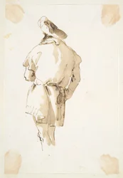 Stående mandsfigur set bagfra